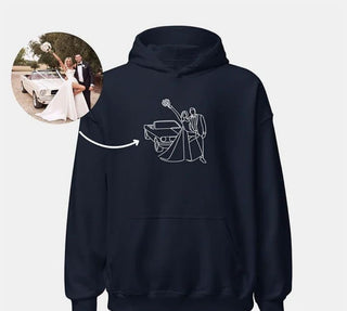 Stylish black hoodie with line art design of a couple in formal attire, possibly a wedding or formal event scene