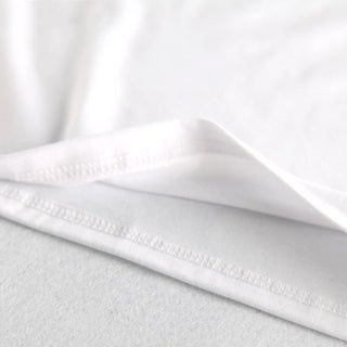 Crisp white cotton fabric with delicate stitching detail, suitable for a variety of fashion garments or family matching t-shirt sets.