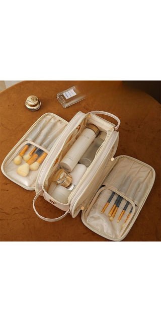 Chic beige cosmetic bag with triple zipper compartments for organized storage of skincare products and makeup essentials.
