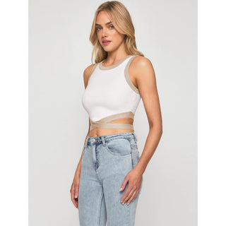 White sleeveless crop top with a knotted front, worn by a young blonde woman against a plain background.
