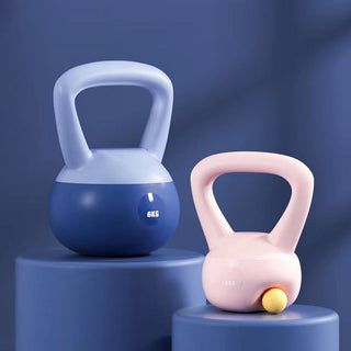 Minimalist fitness kettlebells in modern design. Blue and pink colored kettle weights on a dark background, showcasing their elegant, simple shapes. These kettlebells are versatile fitness equipment for strength training and cardio workouts.