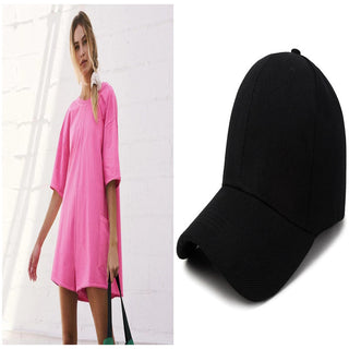 Stylish pink loose dress with sleeves and a black baseball cap