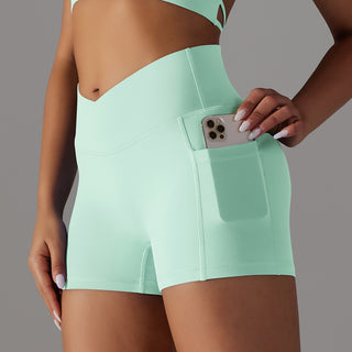 Women's mint green athletic shorts with phone pocket design