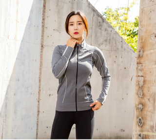 Stylish sportswear for active women, featuring a grey athletic jacket with sleek design.