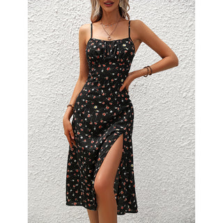 Floral print summer dress with adjustable spaghetti straps and high side slit, showcasing a fashionable and feminine look.