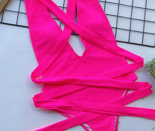 Close-Up of Woman Wearing Vintage-Inspired One-Piece Swimsuit in Vibrant Fluorescent Pink