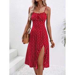 Stylish red polka dot sundress with side slit and spaghetti straps, displayed on a white background.