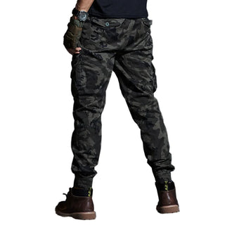 Camouflage cargo pants with multiple pockets, tactical design, and a fashionable army-inspired look.