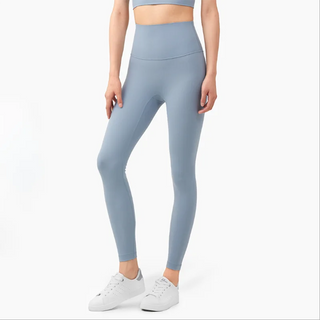 Stylish women's fitness leggings in light gray color, designed for active lifestyles. Featuring a high-waisted, figure-flattering silhouette and a comfortable, stretchy fabric that allows for free movement during workouts.