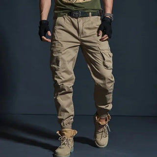 Versatile khaki cargo pants from K-AROLE with multiple pockets, tactical features, and a rugged, fashionable design for men's casual wear.