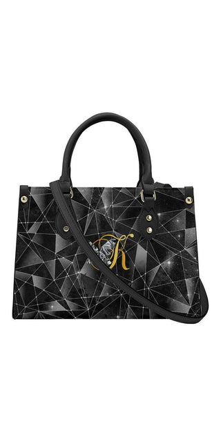 Sleek geometric black leather handbag with silver-toned hardware, K-AROLE.