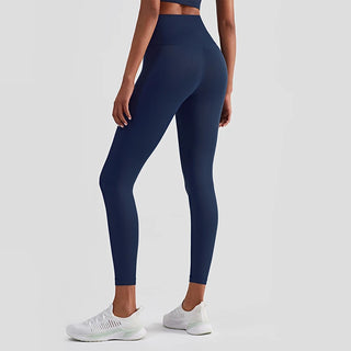 Navy blue high-waisted fitness leggings showcased on a female model wearing sports shoes against a white background.