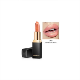 Shimmering coral lipstick with pearlescent color-changing effect, presented in a sleek black and gold package.