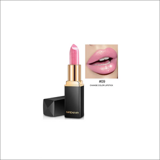 Shimmery pink lipstick in sleek black and gold packaging, showcasing its color-changing pearlescent formula.