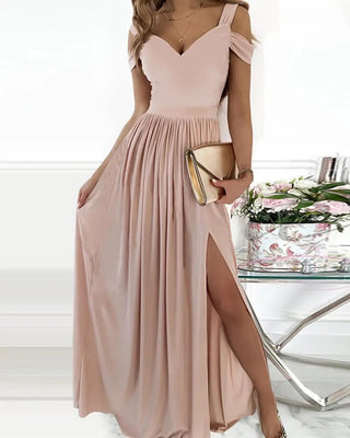 Elegant floral printed maxi dress with tie-waist, stylish pink fashion gown, chic evening wear on display with accessories.