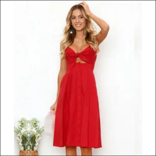 Stylish red summer dress with open cutout detail, worn by a smiling woman with long blonde hair