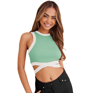 Flattering cropped green tank top with contrasting white details showcasing a stylish woman's midriff and friendly smile.