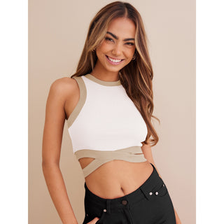 White and beige cropped top with tie-up detail, worn by a smiling young woman with long wavy brown hair