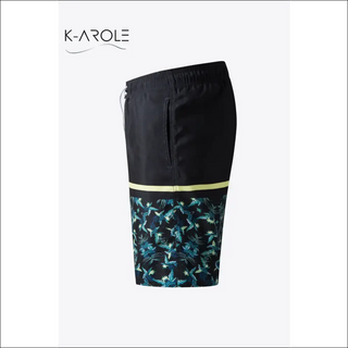 Black and turquoise printed lace-up athletic shorts with a convenient drawstring waist, ideal for an active lifestyle and exercise. These versatile shorts from K-AROLE offer a stylish and comfortable athleisure look.