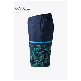 Navy blue printed women's athletic shorts with colorful floral patterns and a lace-up waistband, showcased on a white background with the K-AROLE brand logo.