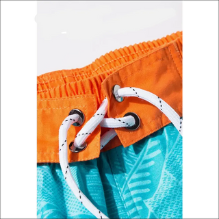 Vibrant orange athletic shorts with stylish white drawstrings for a sporty, modern look from K-AROLE's women's athleisure collection.