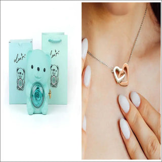 Rotating Eternal Flower Ring Necklace Gift Box - Elegant jewelry item with a heart-shaped pendant and necklace, displayed in a mint-colored gift box.