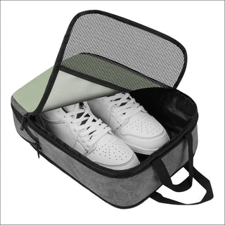 Stylish and supportive training shoes enclosed in a gray K-AROLE gym bag, perfect for your active lifestyle.