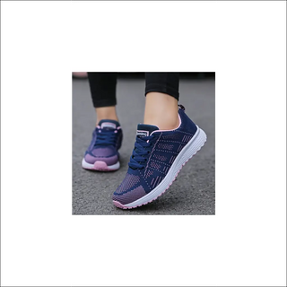 Stylish women's casual sneakers with breathable mesh fabric and comfortable athletic design. Vibrant navy blue color and sleek vulcanized sole for modern, sporty look.