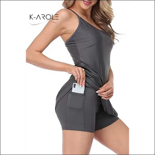 Stylish women's athletic dress with pockets from K-AROLE brand featuring a sleeveless design and figure-flattering silhouette.