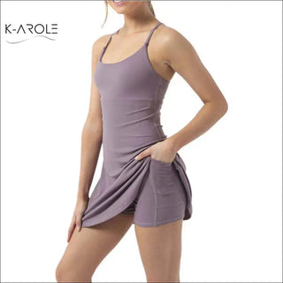 Stylish woman's pocketed tennis yoga running dress featuring a sleeveless design and a figure-flattering silhouette from the K-AROLE fashion brand.