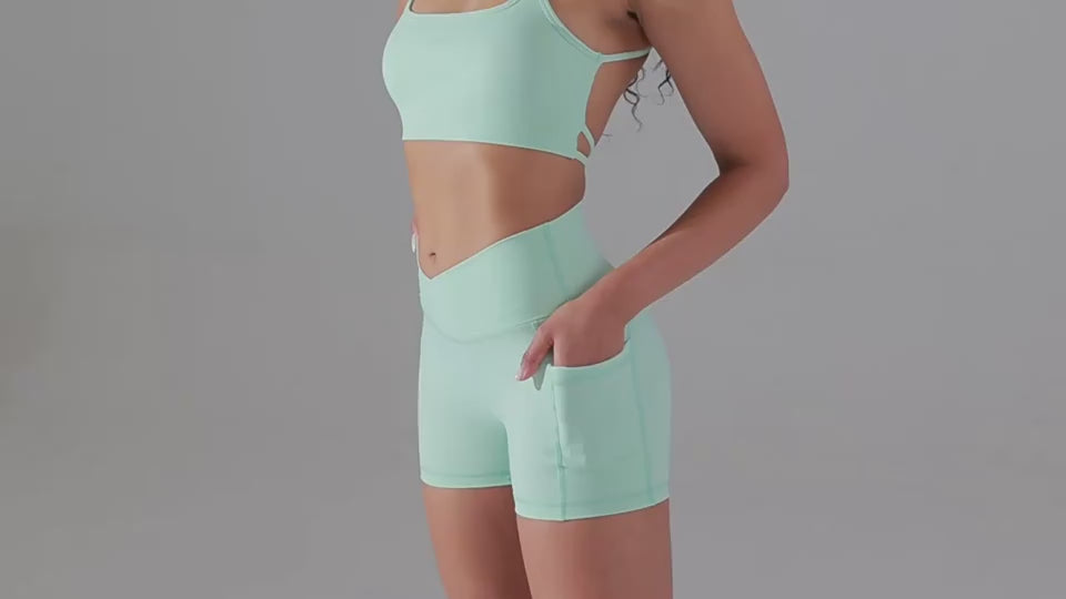 Mint green activewear set with phone pocket design, offering functional fitness attire for women.