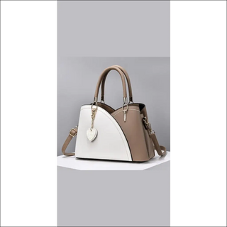 Stylish patchwork handbag with block handle and large capacity for fashionable women.