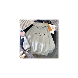 Loose hooded sweatshirt with "C'est La Vie" text print and sports shoes in the image