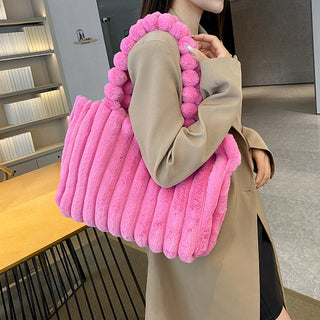 Fluffy and Fashionable: Plush Pink Bag Adds Cozy Charm to Winter Outfit