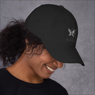 Black K-AROLE branded baseball cap with butterfly logo on dark-haired woman