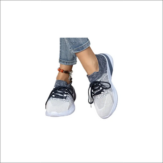 Stylish color-matching mesh sneakers with lace-up design for women's casual or athletic wear.