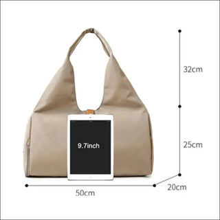 Versatile beige duffle bag with dimensions of 50cm x 32cm x 20cm, suitable for women's yoga, sports, and travel essentials, featuring a tablet pocket for convenient access.