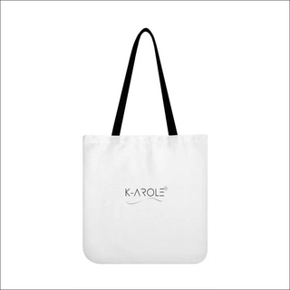 Women's trendy white canvas tote bag with black straps and K-AROLE logo displayed prominently, showcasing the brand's stylish and versatile fashion accessories.