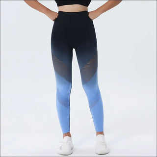 Stylish and sporty ombre performance leggings with sleek black and blue gradient design. Featuring a comfortable high-waisted fit and breathable mesh panels for active wear.