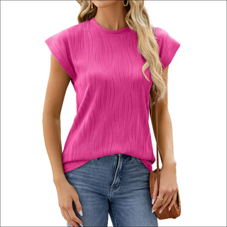 Vibrant pink pleated women's sleeveless shirt with crew neck, worn by a woman with long blonde hair posing against a white background.