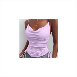 Spaghetti strap camisole in pale pink color with adjustable back and matching pendant necklace on woman's torso.