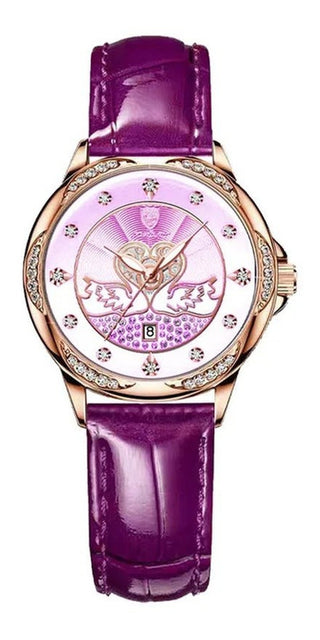 Elegant rose gold women's watch with sparkling crystal bezel, purple leather strap and decorative swan design on the dial, showcased on a plain white background.