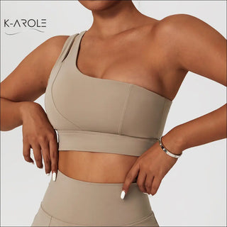 Beige one-shoulder ribbed yoga bra set with stretch and shockproof fabric from the K-AROLE brand.